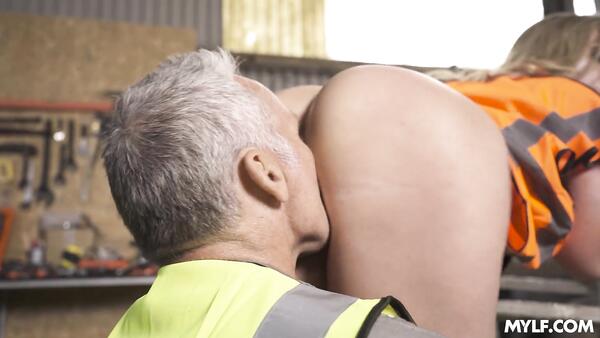 Busty Female Boss Seduces Mature Worker in a Tractor Hangar